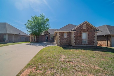 View of front of house with a front yard, stone si