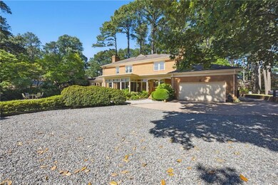 Oversized attached rear entry double + garage with separate outside entrance comes fully insulated and conditioned w/ separate heat pump featuring a Butler’s Quarters, with full bath