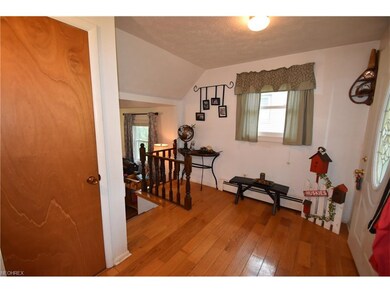 Foyer with hardwood floors.
