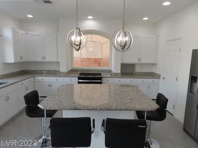 Gorgeous kitchen with granite countertops, an abun
