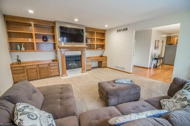 Beautiful family room features a gas fireplace fra