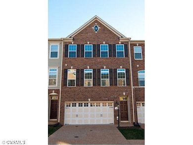 Exterior Front - Brick front with two car garage, 