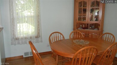 This used to be a bedroom and could be converted back, but this dining room with hardwood floors is perfect when you are entertaining!