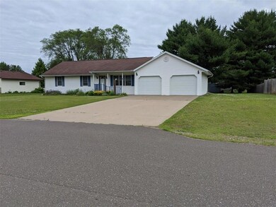 Full concrete driveway up to the attached garage.