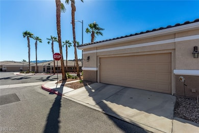 Garage featuring concrete driveway