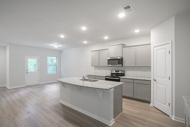 The kitchen also includes a large island that can fit 4 bar stools. A large, corner pantry is also included to provide plenty of storage.