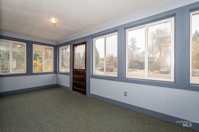 Spare room featuring baseboards