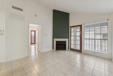 Unfurnished living room with light tile patterned 