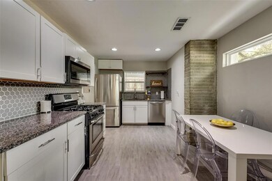 Updated kitchen with stainless appliances and gran