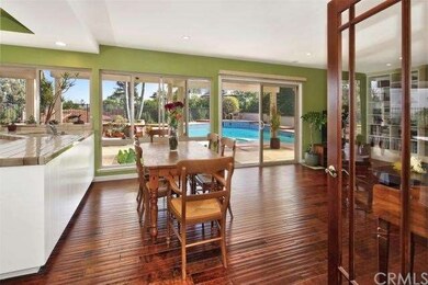 Step through double doors to find kitchen open to 