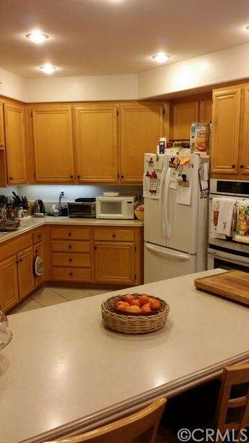 Kitchen with Corian countertops and breakfast bar