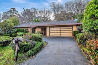 Two-car garage with a horseshoe driveway