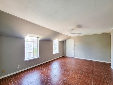 Two large windows lighten the space.