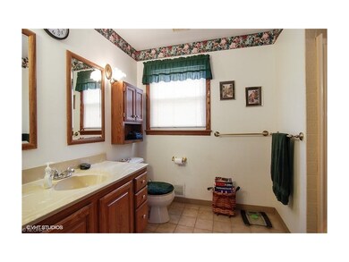 First level bathroom with single sink and over siz
