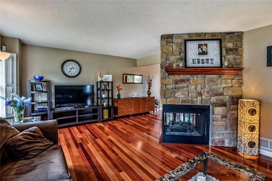The Wall Color and Hardwood Tones complement the F