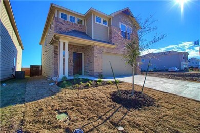 View of front of property with concrete driveway,