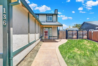 This home as a spacious inner corner lot with paved RV parking with hookup, secured behind a customized gate.  Note the stamped contrete pathway that continues on to a backyard patio. Also, the front fascia board was just renewed/replaced; matching p