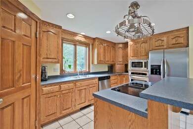 Kitchen has tile floors and lots of...