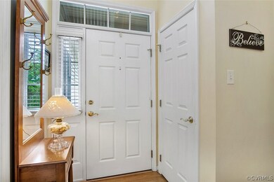 The front door offers a transom above the door and