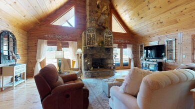 Plenty of natural light with French Doors on both sides of Fireplace. 