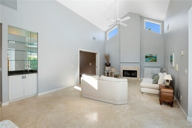Living room with wet bar access makes entertaining