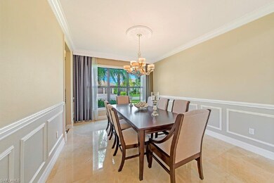 Formal dining room with upgraded lighting.