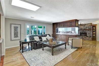 Open living room/family room with custom aquarium 
