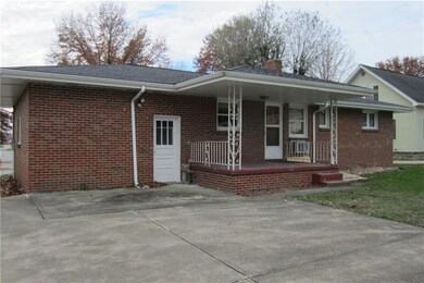 Rearview of home.  Covered rear porch.  Roof, soff