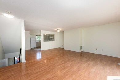 Dining/Liiving room combination. Looking into kitchen.