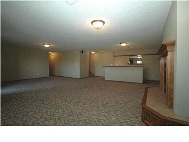 Large open family room with fireplace, wet bar and