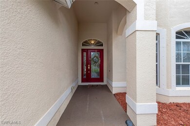 Entrance to property with stucco siding
