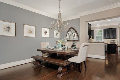 The open layout flows seamlessly into kitchen, per