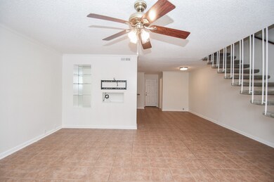 View the TV mount and shelves in the living room a