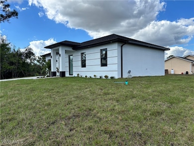 View of property exterior with a lawn