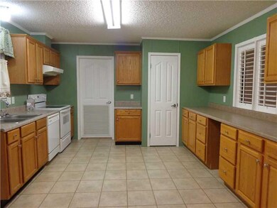 Kitchen. KITCHEN WITH WALLS LINED WITH CABINETS, P