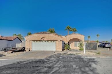 Mediterranean / spanish house featuring concrete driveway, a garage, and stucco siding