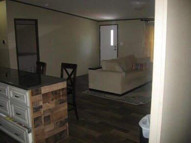 Living area with dark wood-style flooring