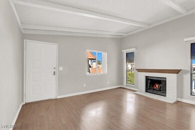 Unfurnished living room with baseboards, lofted ce