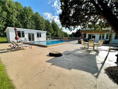 Deck to the expansive patio and pool house.