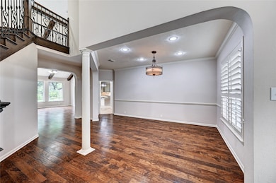 Spacious living area with rich hardwood floors, va