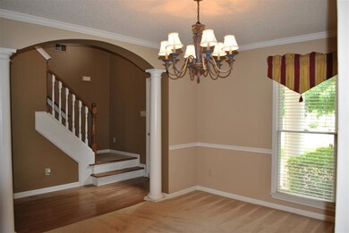 Arched entry to dining room makes a lovely stateme