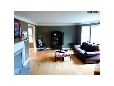 Living Room with hardwood floors, bay window and f