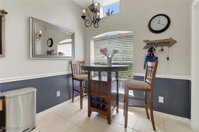 Light and bright tiled breakfast area featuring de