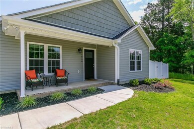 LOVELY front porch is perfect for enjoying your morning cup of Joe
