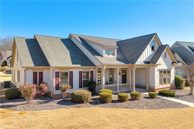 View of front of home featuring a porch and central air condition unit