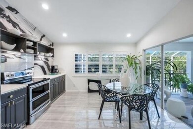 Kitchen with stainless steel range with electric s