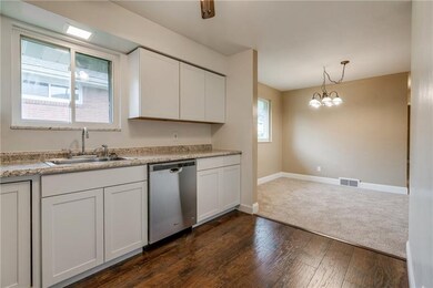 View of the new kitchen and dining area. White sha