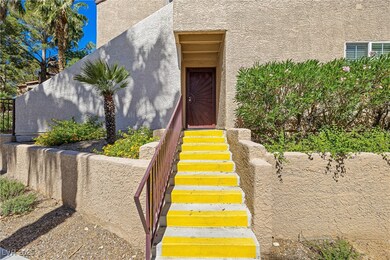 View of exterior entry with stucco siding