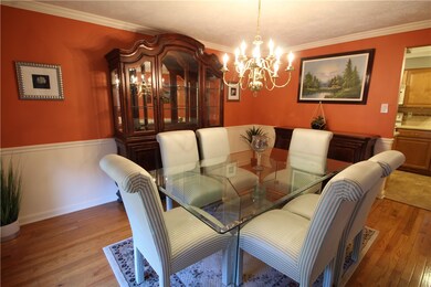 Dining Room w/Gleaming wood floors, crown moldings