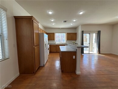 Kitchen featuring white refrigerator with ice disp